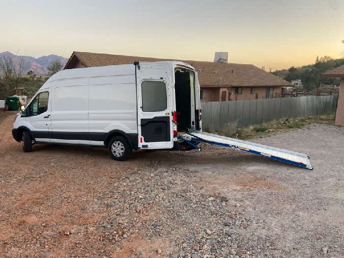 Side view of Tucson Deliveries with loading ramp; lift gate.